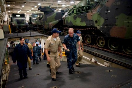 US Navy 100802-N-5319A-013 Ensign Benjamin Hall gives a tour of the amphibious transport dock ship USS New Orleans (LPD 18) to Colombian navy sailors during a port visit to Bahia Malaga Naval Base photo