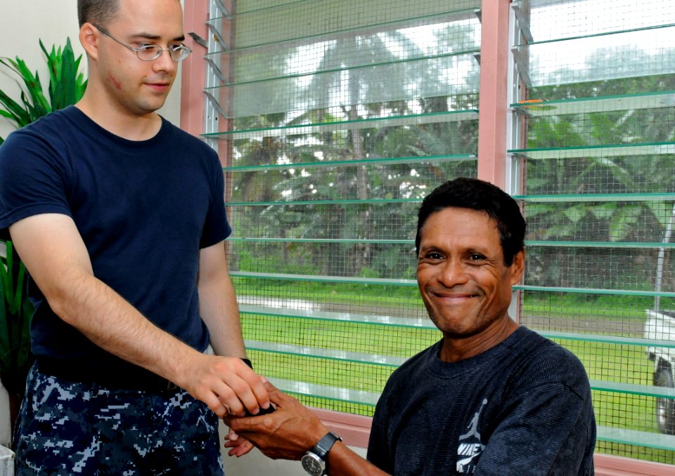 US Navy 100729-N-7280V-362 Hospital Corpsman 3rd Class Steven Nicholson, left, assigned to the U.S. 7th Fleet command ship USS Blue Ridge (LCC 19),