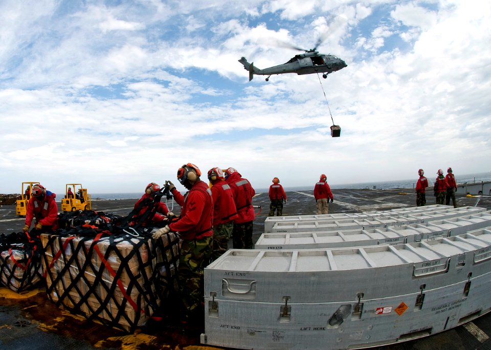US Navy 100730-N-4830B-012 ailors aboard the aircraft carrier USS George Washington (CVN 73) handle cargo during a replenishment at sea with the Military Sealift Command fleet replenishment oiler USNS Walter S. Diehl (T-AO 193)