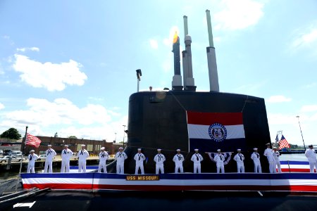 US Navy 100731-N-8467N-003 Sailors man the rails and bring the ship to life during the commissioning ceremony for the Virginia-class attack submarine USS Missouri (SSN 780) at Naval Submarine Base New London photo