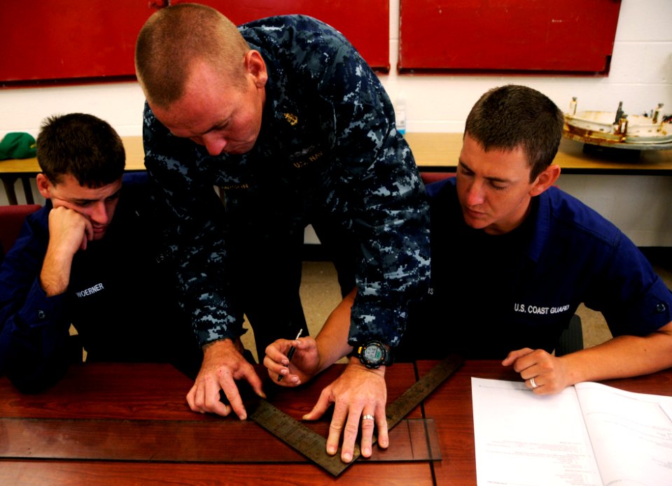 US Navy 100803-N-7498L-069 Chief Damage Controlman Tommy Thompson, an instructor assigned to the Center for Naval Engineering Learning Site, Pearl Harbor, demonstrates how to measure out K-type shoring angles