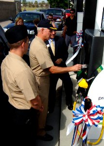 US Navy 100730-N-6676S-031 Capt. K.J. Johnson, commanding officer of Naval Station Norfolk, swipes his credit card to pay for E85 fuel in the first vehicle to use the newest flex-fuel pump built in the Hampton Roads area photo