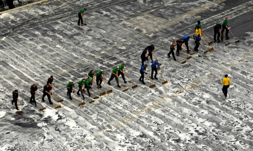 US Navy 100730-N-6362C-069 Sailors and Marines conduct a monthly cleaning of the flight deck aboard the aircraft carrier USS Harry S. Truman (CVN 75)