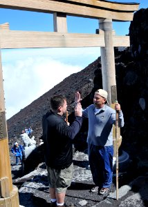 US Navy 100730-N-8113T-087 Chief Engineman David Young, from Fort Pierce, Fla. assigned to Space and Naval Warfare Systems Center, Western Pacific, reenlists at the summit of Mount Fuji with his Officer-in-Charge, Cmdr. Andrew