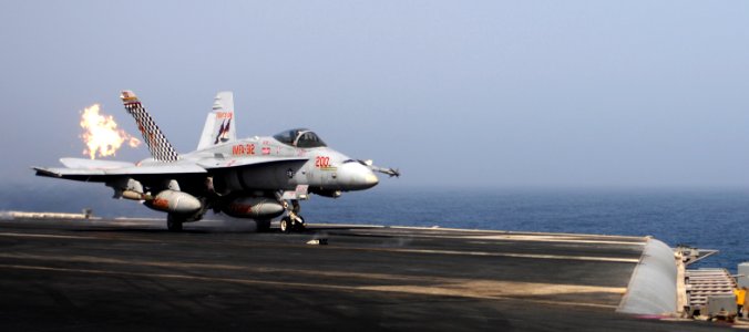 US Navy 100804-N-6362C-229 An F-A-18C Hornet assigned to the Checkerboards of Marine Fighter Attack Squadron (VMFA) 312, ignites afterburners during a launch from the aircraft carrier USS Harry S. Truman (CVN 75)