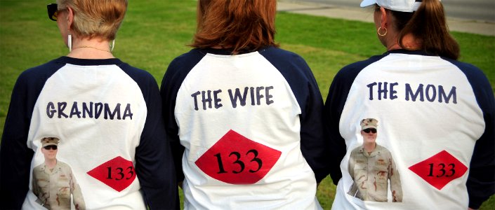 US Navy 100804-N-7367K-002 The family of Construction Mechanic 3rd Class Paul Maloney, assigned to Naval Mobile Construction Battalion (NMCB) 133, awaits the battalion's return during a homecoming celebration photo