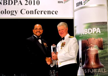 US Navy 100731-N-8273J-400 Chief of Naval Operations (CNO) Adm. Gary Roughead receives a lifetime achievement award the Black Data Processing Association (BDPA) awards gala in Philadelphia