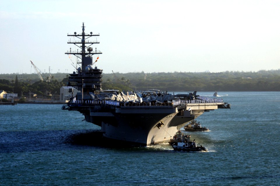 US Navy 100731-N-7605J-727 ailors and Marines man the rails aboard the aircraft carrier USS Ronald Reagan (CVN 76) as the ship arrives in Pearl Harbor for a scheduled port visit