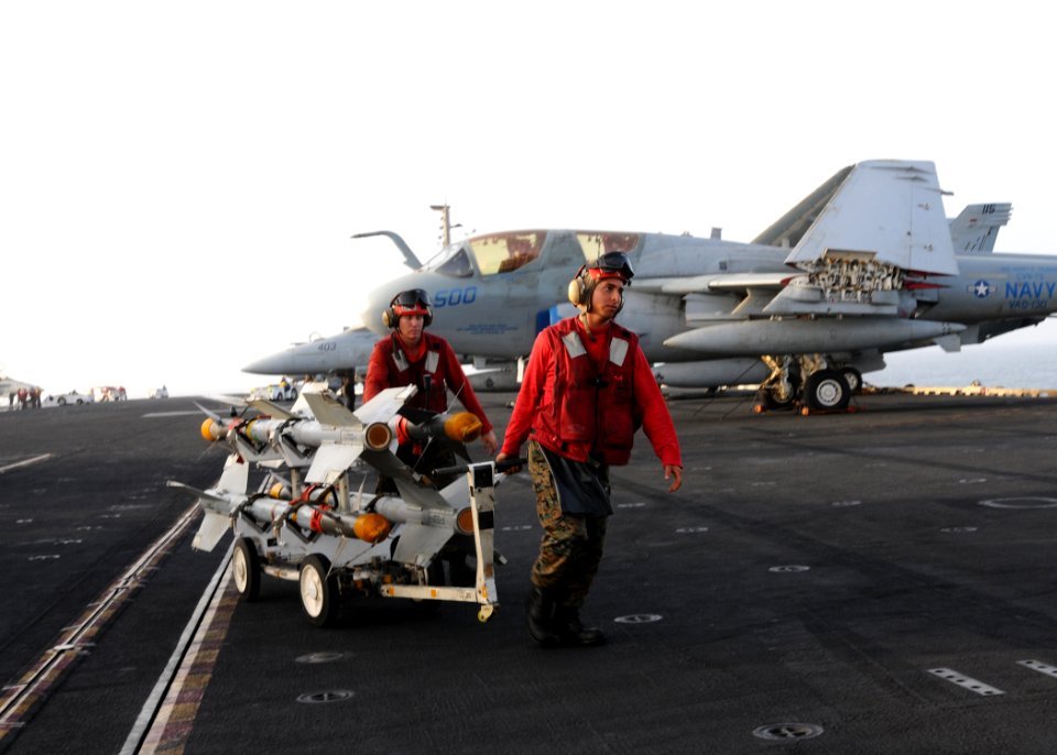US Navy 100801-N-1092P-328 Marines transport ordnance across the flight deck to the bomb farm aboard USS Harry S. Truman (CVN 75)