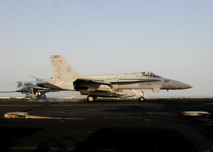 US Navy 100802-N-1092P-331 An F-A-18C Hornet assigned to the Ragin' Bulls of Strike Fighter Squadron (VFA) 37 lands aboard the aircraft carrier USS Harry S. Truman (CVN 75) after flight operations in Afghanistan supporting Oper