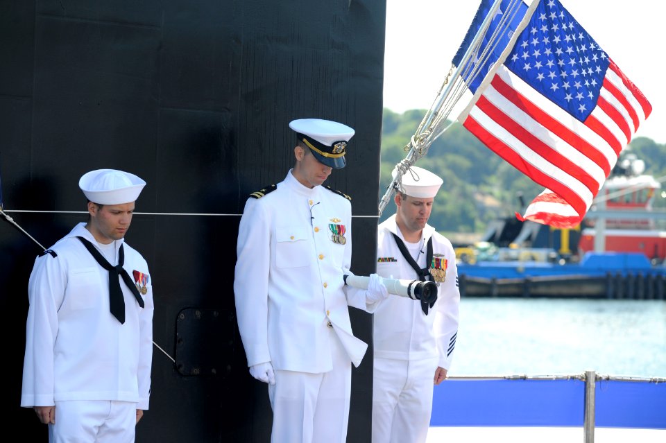 US Navy 100731-N-8467N-008 Sailors aboard the Virginia-class attack submarine USS Missouri (SSN 780) bow their heads during the boat's commissioning ceremony