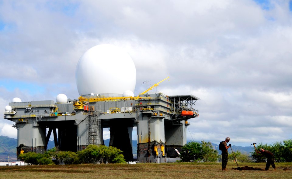 US Navy 100805-N-7498L-334 Sailors dig a hole for the dog park construction project on Ford Island. Behind them is the Sea-Based X-Band Radar
