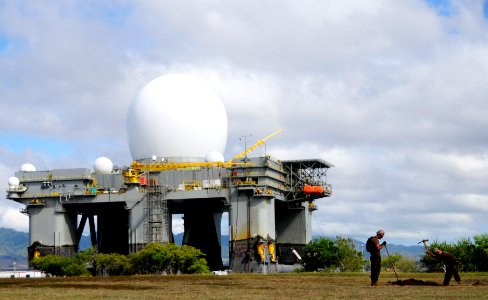 US Navy 100805-N-7498L-334 Sailors dig a hole for the dog park construction project on Ford Island. Behind them is the Sea-Based X-Band Radar