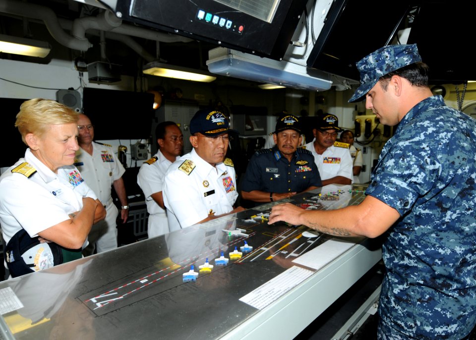 US Navy 100802-N-6632S-123 Rear Adm. Nora Tyson and Adm. Tan Sri Abdul Aziz Jaafar receive a brief in flight deck control during a tour aboard USS George H.W. Bush (CVN 77)
