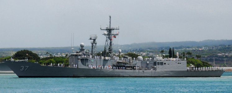 US Navy 100803-N-3666S-058 Sailors man the rails aboard the guided-missile frigate USS Crommelin (FFG 37) as the ship gets underway for a scheduled deployment to the western Pacific Ocean