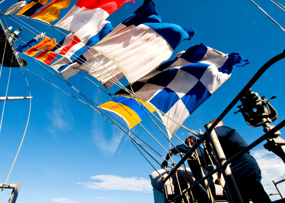 US Navy 100802-N-4830B-084 Quartermasters lower signal flags during an emergency breakaway drill aboard the aircraft carrier USS George Washington (CVN 73)