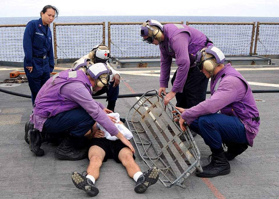 US Navy 100804-N-1082Z-071 Medical department personnel train stretcher bearers on proper procedures during a mass casualty drill aboard USS Ashland (LSD 48)