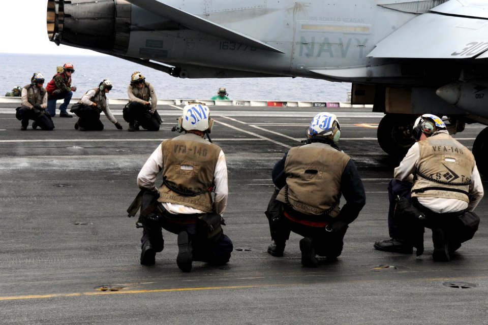 US Navy 100807-N-7605J-683 Sailors prepare to launch the last F-A-18C Hornet from the Blue Diamonds of Strike Fighter Squadron (VFA) 146 during the Carrier Air Wing (CVW) 14 fly-off