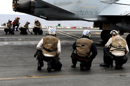 US Navy 100807-N-7605J-683 Sailors prepare to launch the last F-A-18C Hornet from the Blue Diamonds of Strike Fighter Squadron (VFA) 146 during the Carrier Air Wing (CVW) 14 fly-off