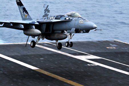 US Navy 100807-N-5749W-490 Rear Adm. Mark D. Guadagnini, commander of the Abraham Lincoln Carrier Strike Group, lands an F-A-18E Super Hornet