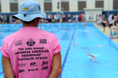 US Navy 100808-N-2858S-211 A volunteer monitors the competitors during the swim portion of the 24th Japanese American Friendship Triathlon at Naval Air Facility Atsugi