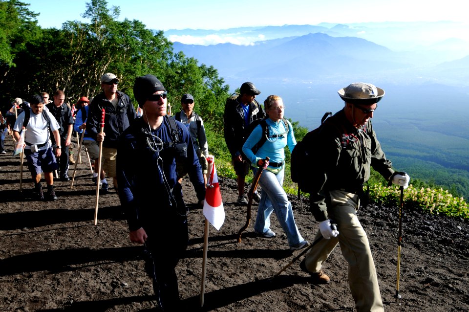 US Navy 100807-N-8335D-113 Dan Knight, a guide with the Fleet Activities Sasebo Sailing and Outdoor Adventure Center, leads a group of Sailors up Mount Fuji
