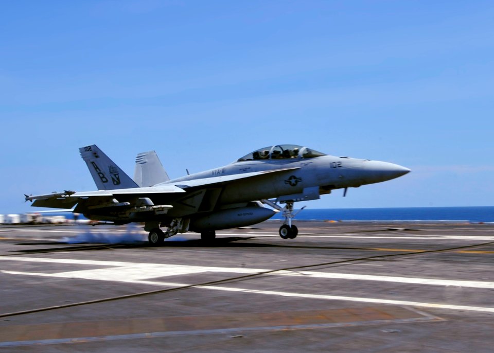 US Navy 100804-0569K-N-001 An F-A-18F Super Hornet assigned to the Red Rippers of Strike Fighter Squadron (VFA) 11 lands aboard the aircraft carrier USS Enterprise (CVN 65)