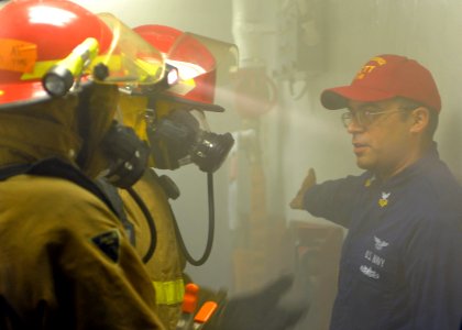 US Navy 100807-N-1287L-099 Aviation Electronics Technician 1st Class Michael L. Kohan gives critiques to the fire team leader