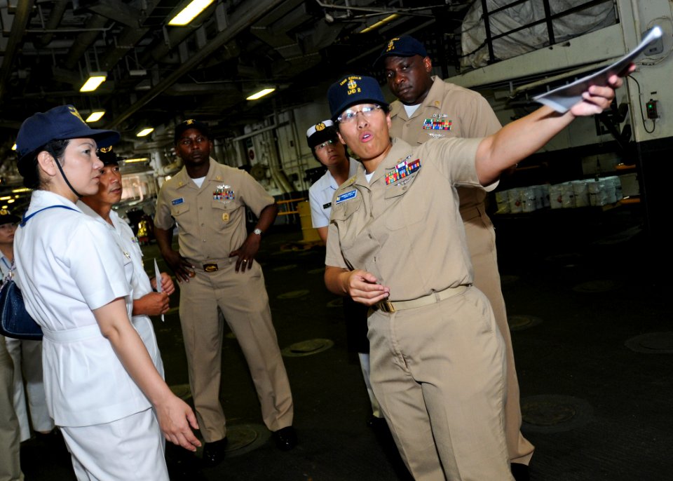 US Navy 100804-N-9950J-030 Chief Information Systems Technician Jannett King hosts Japan Maritime Self-Defense Force Sailors during a tour aboard USS Essex (LHD 2)
