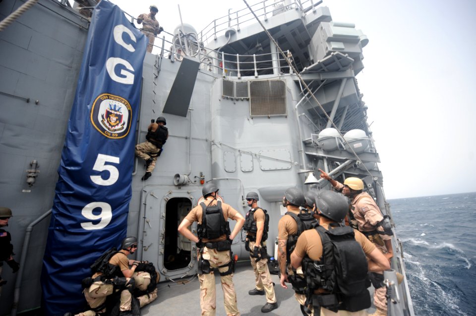 US Navy 100804-N-6463B-109 Sailors assigned to the ship's visit, board, search and seizure team and Coast Guardsmen assigned to Law Enforcement Detachment 404
