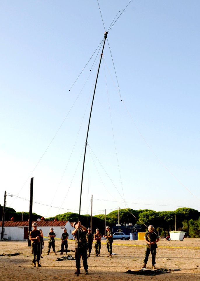 US Navy 100807-N-6357K-003 Seabees assigned to Naval Mobile Construction Battalion (NMCB) 7 erect an OE-254 antenna during a training exercise at Camp Mitchell, Naval Station in Rota, Spain