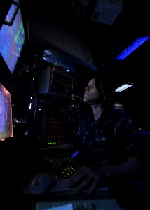 US Navy 100805-N-2013O-025 Operations Specialist Seaman Jennifer Sullivan mans a tactical link console in the combat direction center aboard USS George Washington (CVN 73)