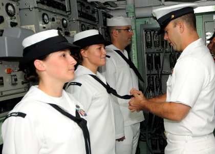 US Navy 100806-N-1082Z-003 Senior Chief Information Systems Technician Justin L. Pendergraph conducts a uniform inspection