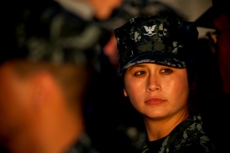 US Navy 100809-N-5319A-033 Boatswain's Mate 3rd Class Renee Cabrales stands in ranks during a reenlistment ceremony on the foc'sle of USS New Orleans (LPD 18) photo