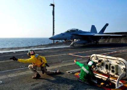US Navy 100805-N-0569K-019 A shooter gives the signal that an F-A-18F Super Hornet assigned to the Red Rippers of Strike Fighter Squadron (VFA) 11 is cleared to launch from the aircraft carrier USS Enterprise (CVN 65)