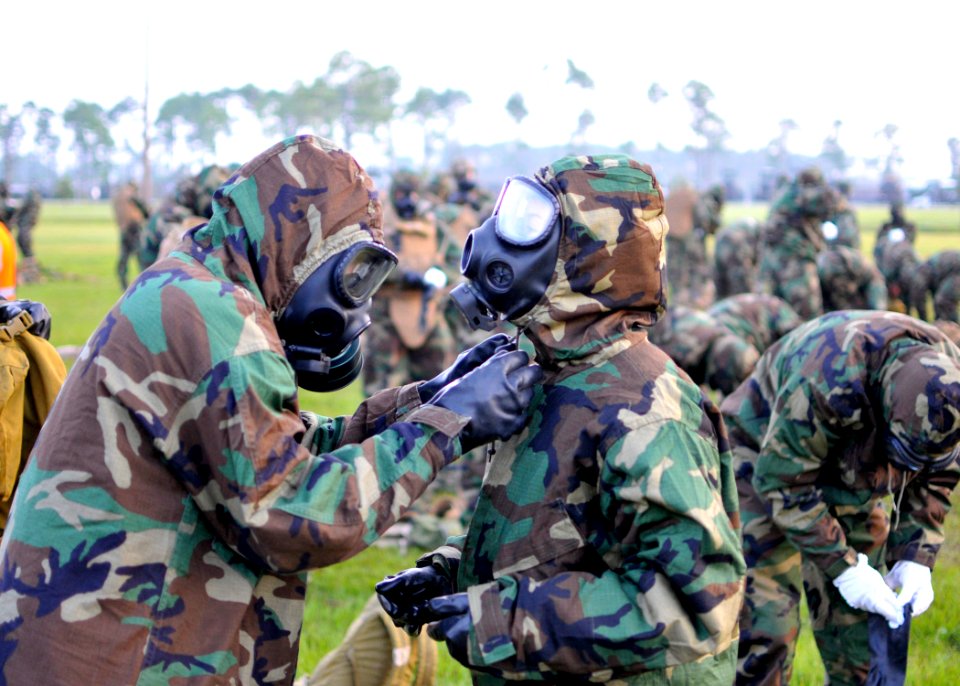US Navy 100806-N-4440L-042 Seabees don their chemical, biological, radiological gear during a mission oriented protective posture (MOPP) level 4 drill