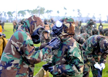 US Navy 100806-N-4440L-042 Seabees don their chemical, biological, radiological gear during a mission oriented protective posture (MOPP) level 4 drill
