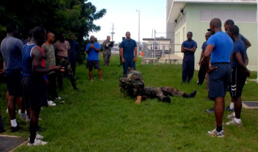 US Navy 100810-N-4971L-379 Equipment Operator 1st Class Daniel Lasich conducts defensive combat tactics with Barbados Defense Forces during a subject matter expert exchange in Bridgetown