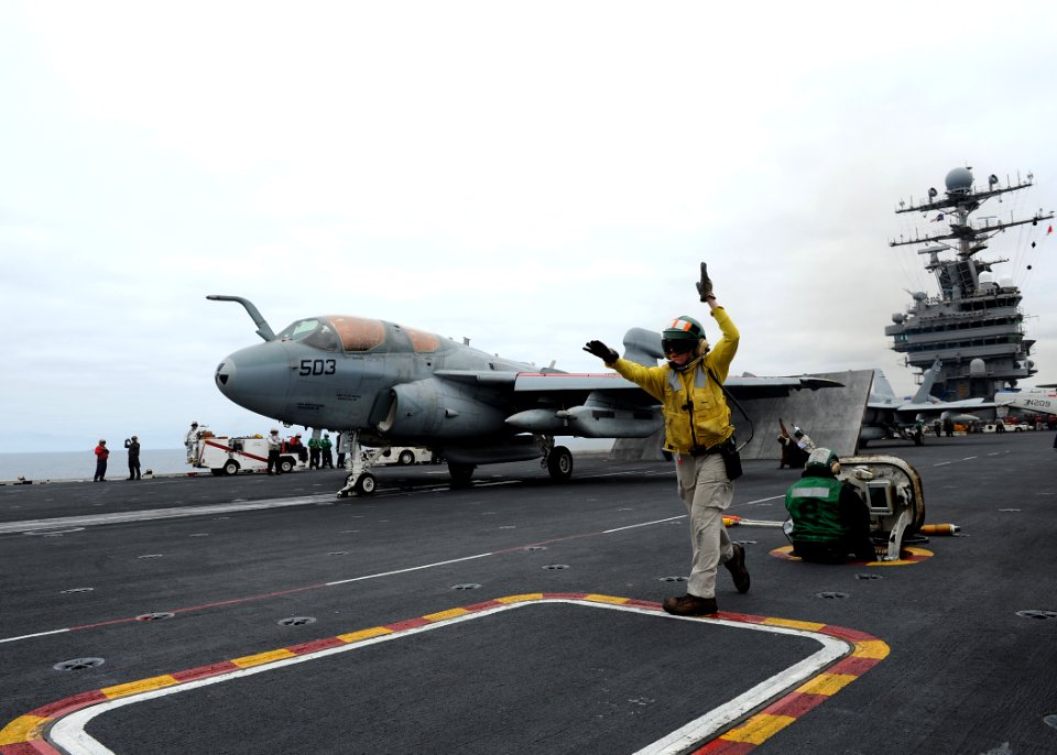 US Navy 100807-N-2821G-503 An EA-6B Prowler awaits the launch signal before launching off the flight deck of USS Abraham Lincoln (CVN 72)