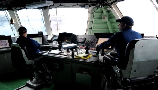 US Navy 100807-N-7058E-038 Chief Quartermaster Joseph Radford, left, watches as Lt. Adam Beauchene, officer of the deck for the littoral combat ship USS Freedom (LCS 1), photo