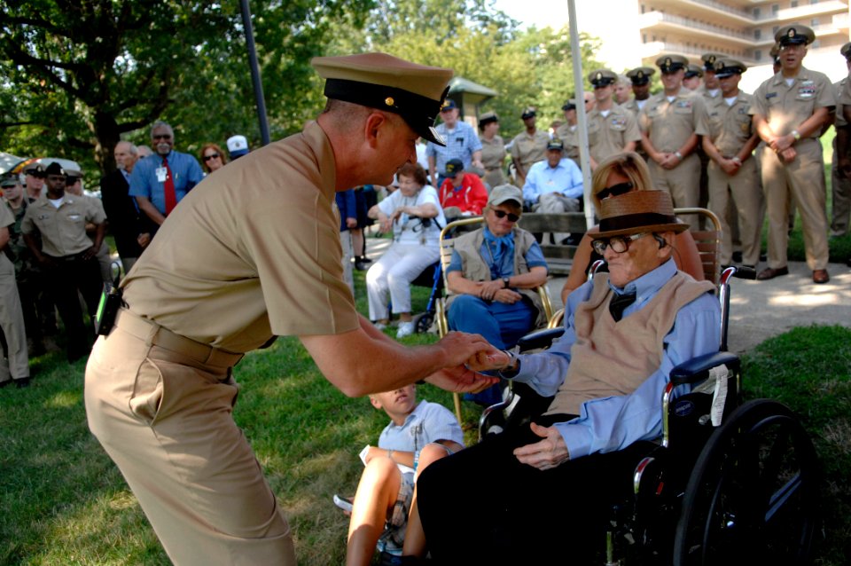 US Navy 100810-N-9818V-149 Master Chief Petty Officer of the Navy (MCPON) Rick West meets Lorenzo Senires, who enlisted in the Navy in 1926, at the Armed Forces Retirement Home