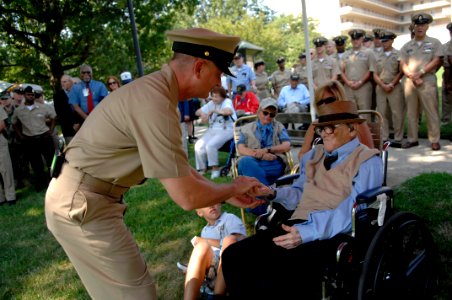 US Navy 100810-N-9818V-149 Master Chief Petty Officer of the Navy (MCPON) Rick West meets Lorenzo Senires, who enlisted in the Navy in 1926, at the Armed Forces Retirement Home