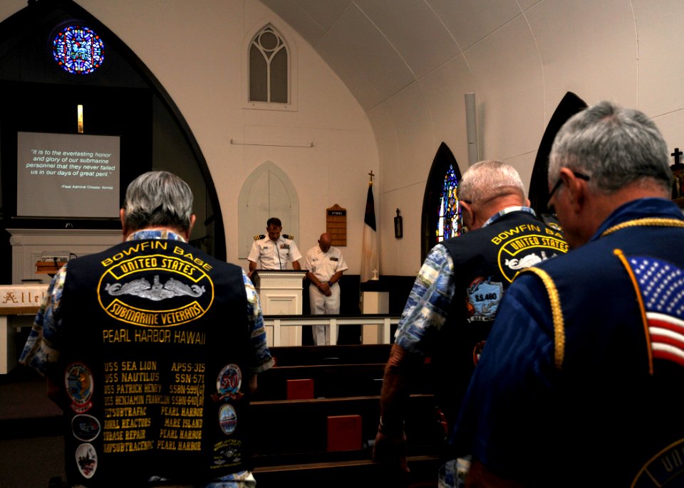 US Navy 100811-N-3560G-001 Cmdr. David Bynum speaks about the lost of naval submarines during the month of Aug. throughout World War II during a special bell-tolling service at Joint Base Pearl Harbor-Hickam Submarine Memorial