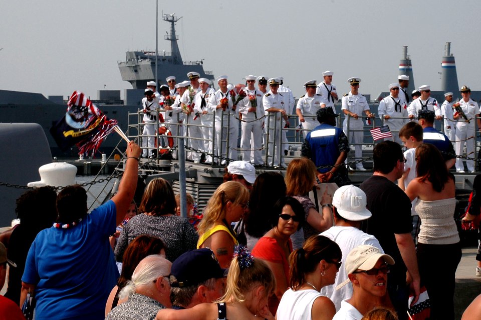 US Navy 100811-N-5292M-493 Family and friends wait on the pier as the guided-missile cruiser USS San Jacinto (CG 56) arrives at Naval Station Norfolk