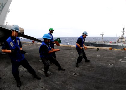 US Navy 100809-N-4830B-085 Sailors hold a distance line aboard the aircraft carrier USS George Washington (CVN 73) during a replenishment at sea photo