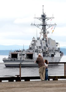 US Navy 100809-N-7783B-006 Seattle resident Tod McClaskey and his granddaughter watch the Arleigh Burke-class guided-missile destroyer USS Kidd (DDG 100) depart Pier 66 after participating in the 61st annual Seattle Seafair Nav photo