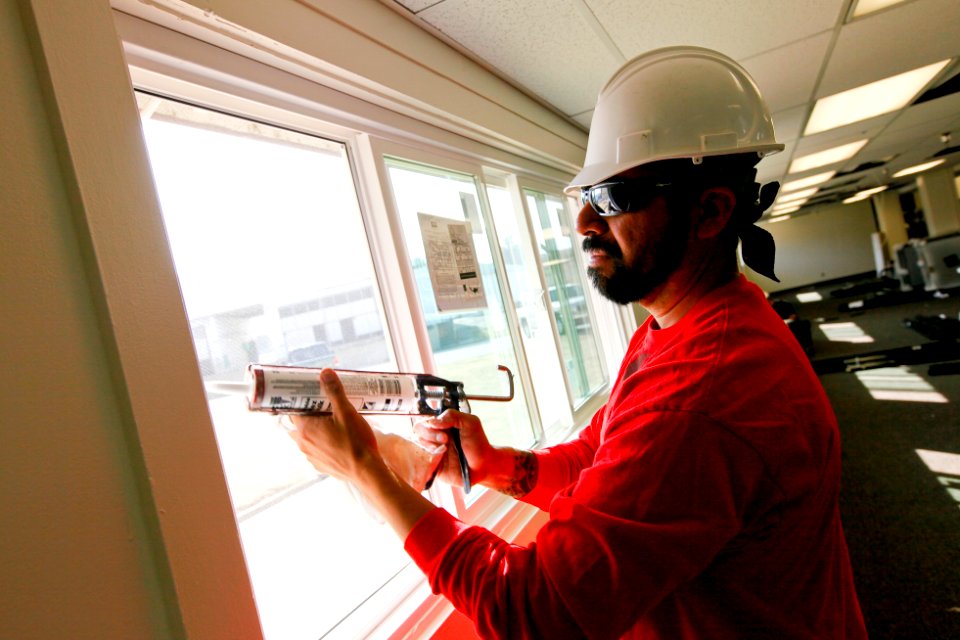 US Navy 100809-N-8863V-043 A construction worker installs new energy-efficient windows in Bldg. 519 at Naval Surface Warfare Center
