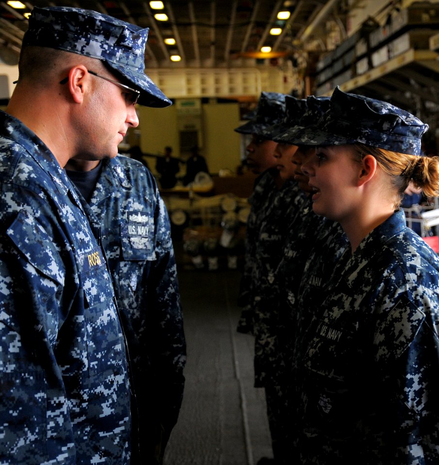 US Navy 100809-N-4649B-059 Capt. Erik Ross onducts a personnel inspection