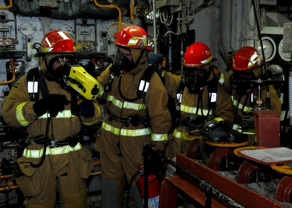 US Navy 100811-N-4649B-066 A damage control repair locker overhaul team aboard the amphibious assault ship USS Bataan (LHD 5) investigates the aft main machinery room