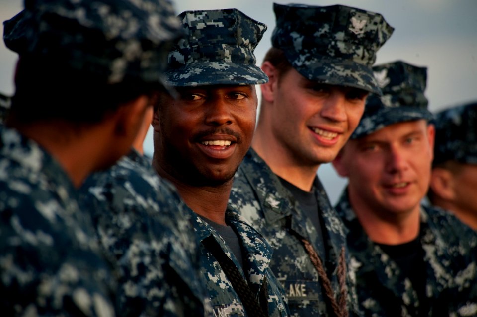 US Navy 100809-N-5319A-018 Seaman Jan Lane, center, stands in ranks during a reenlistment ceremony on the foc'sle of the amphibious transport dock ship USS New Orleans (LPD 18) as the ship participates in Southern Partnership S